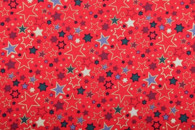 Vianočná látka z bavlny v červenej farbe s potlačou farebných hviezdičiek 12714/015