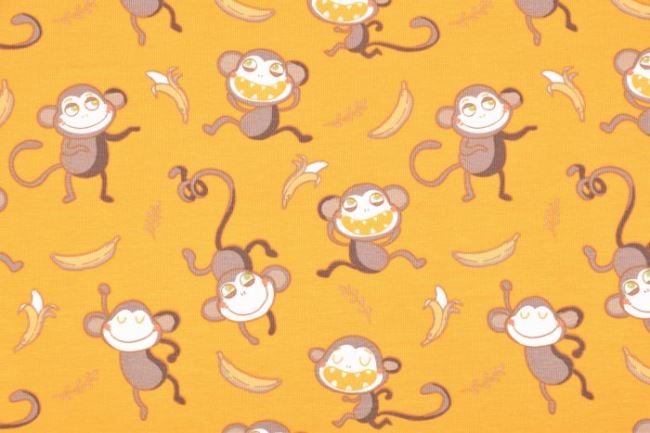Bavlnený úplet v žltej farbe s potlačou opičiek 64981