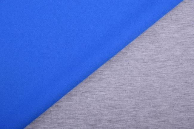 Obojstranná kostýmová látka v kombinácii modrej farby a svetlo šedého melíru 12535/650