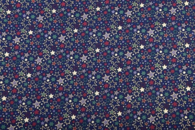 Vianočná látka z bavlny v tmavo modrej farbe s potlačou farebných hviezdičiek 12714/008