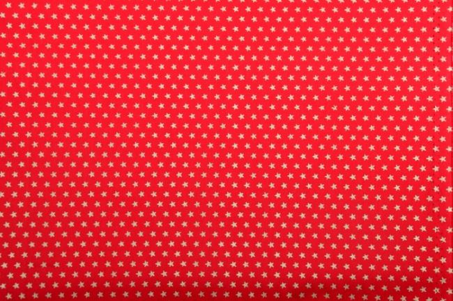 Vianočná látka z bavlny v červenej farbe s potlačou hviezdičiek 12702/015